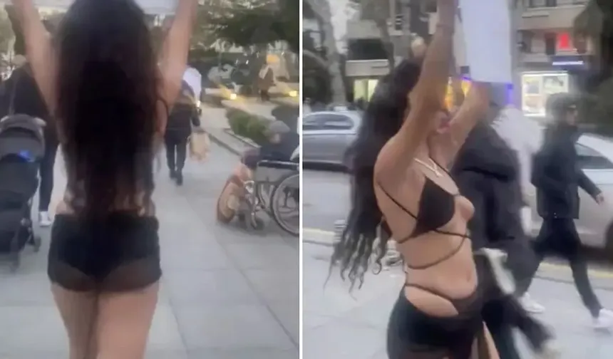Eline pankart alarak yarı çıplak şekilde yeniden sokağa çıktı! Vatandaşlar pankartı yırtarak tepki gösterdi